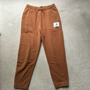 Air Jordan flight sweatpants, orange, with cuffed bottoms, (large)